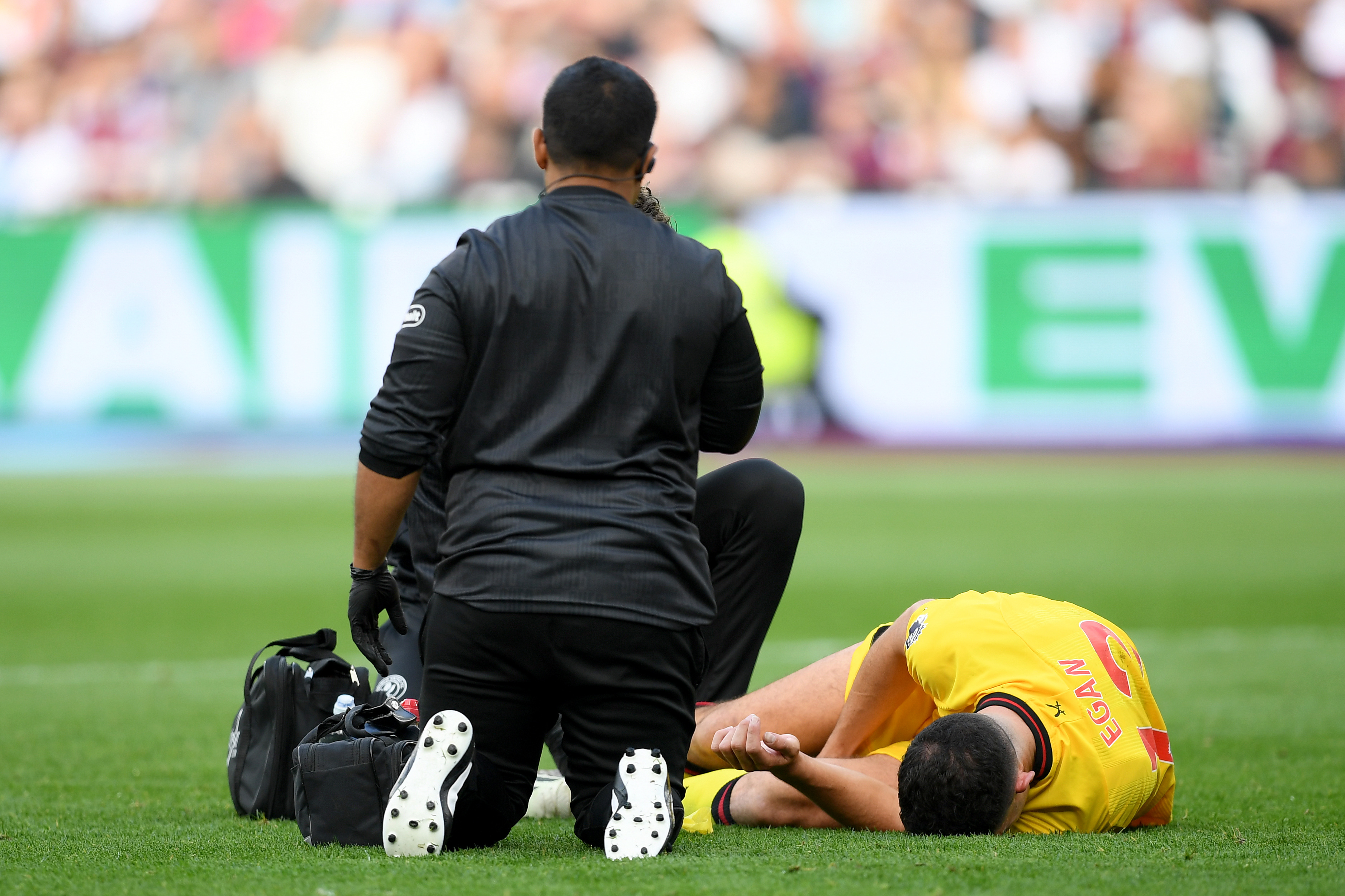 Sheffield United defender John Egan receiving treatment for an injury against West Ham.