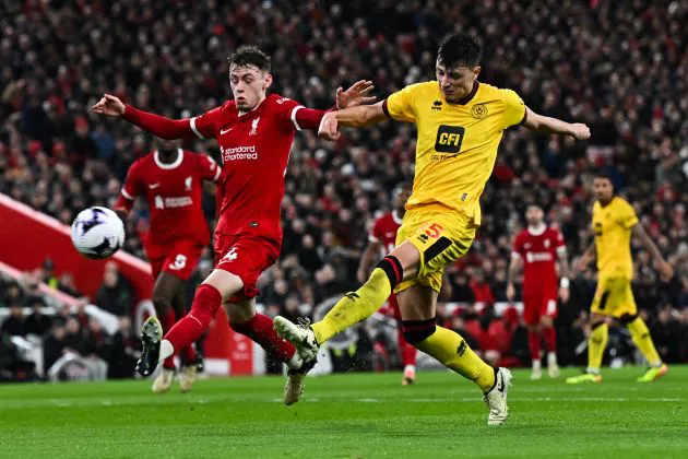 Anel Ahmedhodzic in action against Liverpool as Sheffield United suffer defeat at Anfield.